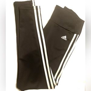Adidas AEROREADY black tights with white signature stripes on the side.
